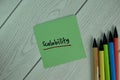 Scalability write on sticky notes isolated on Wooden Table