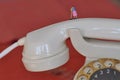 scale H0 diorama: disturbed isdn high speed telephone shown as housewife with broom on phone handset Royalty Free Stock Photo