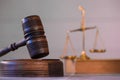 Scale of justice. Wooden judge`s gavel. The criminal law. Royalty Free Stock Photo