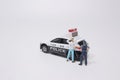 A Scale police car model with figure catch thief