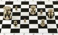 Scale steel shiny weights on chessboard surface
