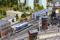 A scaled-down model of a railway depot with a train and a coal unloading place with a crane and a railway Royalty Free Stock Photo