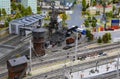 A scaled-down model of a railway station for unloading coal with a crane, trucks and a railway Royalty Free Stock Photo