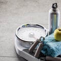 Scales after athletic training, aerobics and weight control at gym Royalty Free Stock Photo