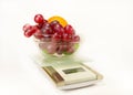Scales with grapes, lime and orange Royalty Free Stock Photo