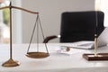 Scales of justice on desk in notary`s office Royalty Free Stock Photo