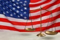 Scales of justice on light grey table against American flag. Space for text Royalty Free Stock Photo