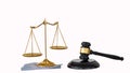 Scales of justice placed on silver and judge hammer on white background Royalty Free Stock Photo