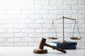Scales of justice, wooden gavel and books Royalty Free Stock Photo