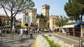 Scaligeri Castle, Sirmione, Italy. A lot of flowers and the stone walls