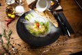 Scallop ceviche with mango, chilli and cilantro served with liquid ice smoke in a plate. Delicious healthy food closeup Royalty Free Stock Photo