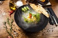 Scallop ceviche with mango, chilli and cilantro served with liquid ice smoke in a plate. Delicious healthy food closeup Royalty Free Stock Photo