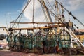 Scallop dredge hanging in a harbour Royalty Free Stock Photo