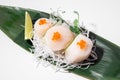 Scallop sashimi on white background. Traditional Japanese food. Raw scallop served with red salmon caviar. Sushi restaurant menu Royalty Free Stock Photo