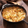 Scalloped potatoes in rustic iron skillet