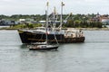 Scalloper Nordic Pride towering over sailboat Laura P