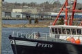 Scalloper Pyxis transiting New Bedford hurricane protection barrier Royalty Free Stock Photo