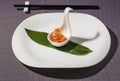 Scallops gunkan and caviar, served in a cup over a bamboo leaf Royalty Free Stock Photo
