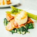 Scallops shell with bacon and asparagus Royalty Free Stock Photo