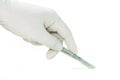 Scalpel in a hand with rubber glove Royalty Free Stock Photo