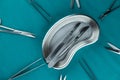 scalpel handle with blade in emesis or plus basin on surgical green drape Royalty Free Stock Photo