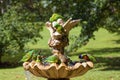Scaly-breasted Lorikeet birds splash fun in fountain in park