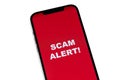 Scam Alert concept on red screen mobile Royalty Free Stock Photo