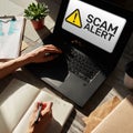 Scam alert detecting warning. Notification on device screen. Royalty Free Stock Photo