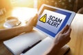 Scam alert detecting warning. Notification on device screen Royalty Free Stock Photo