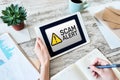 Scam alert detecting warning. Notification on device screen Royalty Free Stock Photo