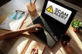 Scam alert detecting warning. Notification on device screen. Royalty Free Stock Photo