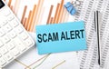SCAM ALERT text on the sticker on diagram background Royalty Free Stock Photo