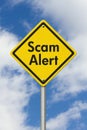 Scam Alert yellow warning highway road sign