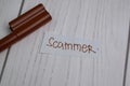 Scammer write on sticky notes isolated on office desk Royalty Free Stock Photo