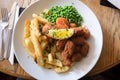 Scampi, chips and peas: traditional British pub meal - elevated view