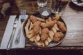 Scampi and chips popular British pub food, on a plate, on a wooden table