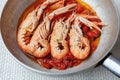 Scampi cooked with cherry tomato sauce