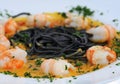 Scampi with pasta and curry Royalty Free Stock Photo