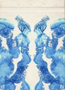 Scan of a card of a colored rorschach inkblot test. Blue color watercolor paint symmetric blotch on old vintage paper. Abstract wa Royalty Free Stock Photo