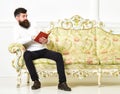 Scandalous bestseller concept. Guy reading book with amazement. Macho on surprised face reading book. Man with beard and Royalty Free Stock Photo