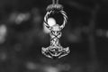 Scandinavian amulet in the form of the Thor`s hammer. Royalty Free Stock Photo