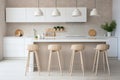 Scandinavian bar stools decorate a modern kitchen in calm neutral tones Royalty Free Stock Photo