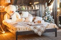 Scandinavian bedroom interior under Christmas. Textural wooden bed in the style of New Year`s Rustic decorated. Royalty Free Stock Photo