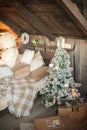 Scandinavian bedroom interior under Christmas. Textural wooden bed in the style of New Year`s Rustic decorated. Royalty Free Stock Photo