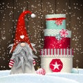 Scandinavian christmas traditional gnome, Tomte, with stack of colorful gift boxes, illustration Royalty Free Stock Photo