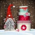 Scandinavian christmas traditional gnome, Tomte, with stack of colorful gift boxes, illustration