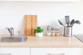 Scandinavian classic minimalistic kitchen with white and wooden details. Modern white kitchen clean contemporary style interior Royalty Free Stock Photo