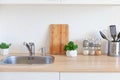 Scandinavian classic minimalistic kitchen with white and wooden details. Modern white kitchen clean contemporary style interior Royalty Free Stock Photo