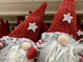 Scandinavian gnome in red hat decorative christmas toy in the supermarket, nobody pair