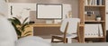 Scandinavian home working space interior design with PC computer desktop mockup on wood table Royalty Free Stock Photo